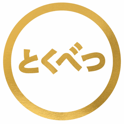A gold circle surrounds stylized Japanese characters on a white background. The characters are written in gold and read 