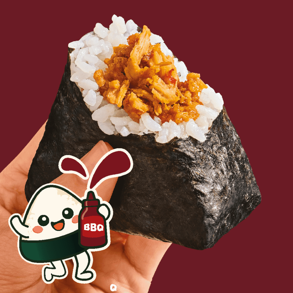A hand holds a triangular rice ball wrapped in seaweed and filled with shredded BBQ meat. A cute cartoon rice ball character squirts BBQ sauce from a bottle. The background is a solid maroon color.